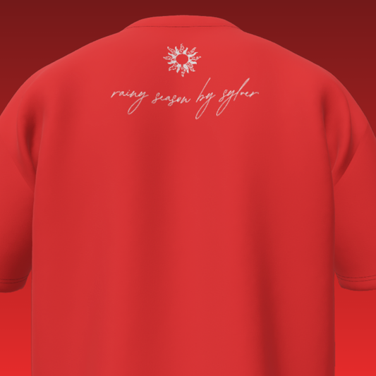 Red t-shirt with 'raising season by syler' text on the back against a red background