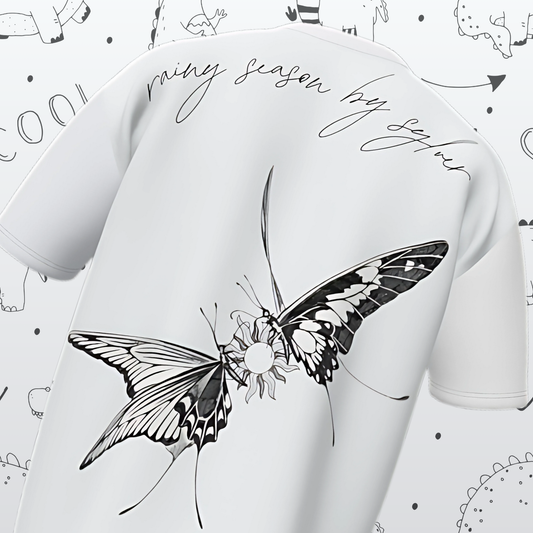 White t-shirt with black butterfly design and text on a white background