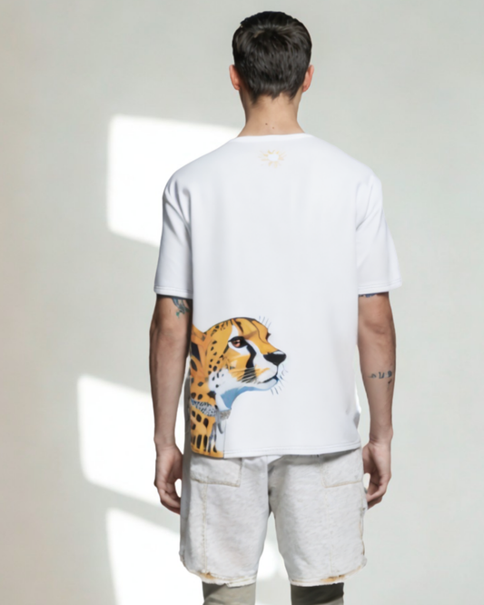 Person wearing a white t-shirt with a cheetah graphic on the back, standing against a plain background.